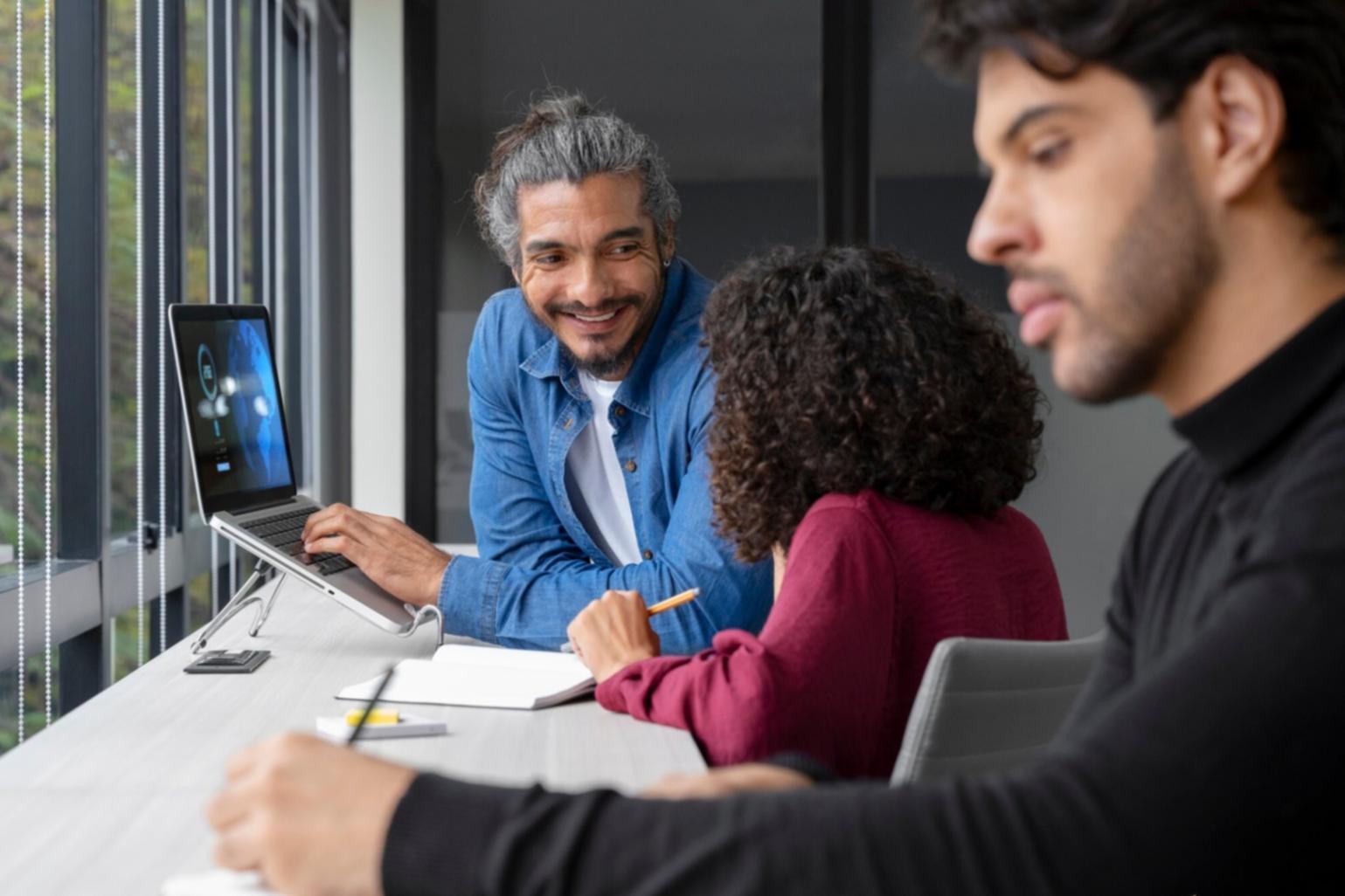 Person reviewing financial documents at home office setup